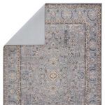 Rug corner flipped to reveal solid light gray underside backing