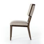 Side view of Jax Dining Chair highlighting the angled wing back profile and birch framed upholstery