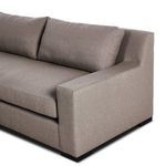 Detailed view of boxy armrest and matching back cushions on right side of sectional