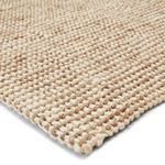 close-up angled view showing thick chunky weave and natural fiber texture in white and tan
