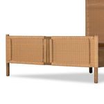 Close-up of footboard panel with tight woven rattan on toasted sungkai wood frame