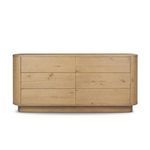Six-drawer dresser in light worn oak with rounded edges and pedestal base