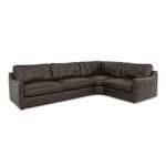 Angle view from left front showing tufted cushions and beveled arm design on brown leather sectional