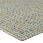 Close-up angled view showing chunky ridged weave and wool-PET blend fibers