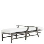 Side view of chaise fully reclined with white cushion and curved armrests on gray frame