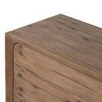 Close-up of top corner showing rounded chamfered edges and wood grain detail