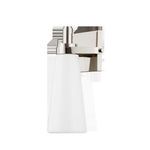 Isolated Trude Wall Sconce showing glossy metal frame and white tapered glass shade on white background
