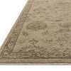 Close-up low angle showing rug’s edge, pile texture, and subtle color variations in wool fibers