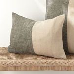 Jules Pillow styled on wicker bench alongside a larger cushion with matching dual-tone pattern