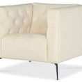 Nicolla Chair angled view showing button tufted interior on shelter arms and seat
