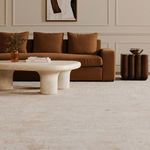 Modern living room setting with the silver decorative bowl resting on a dark wooden side table