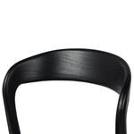 Lower section close-up showing black wooden legs and footrest bars