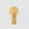 Truett Wall Sconce front view showing full knurled cylinder light and round backplate in aged brass