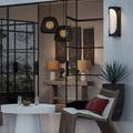 Osbert Black Pendant hanging from ceiling fixture with black metal mounting plate and chain