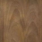 Close-up of the wood grain texture and finish of the cabinet’s interior back panel in warm brown tone.