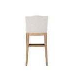 Back view of Gaston Stool showing upholstered back and wooden frame with horizontal support