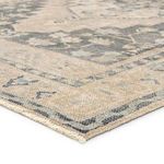 Low angle close-up showing textured woven surface and edge binding of the rug