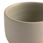 Close-up of interior and rim of matte cream ceramic salt jar