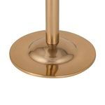 Close-up of circular gold steel base with polished finish supporting the ice bucket stand