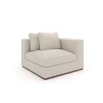 Corner wedge sofa shown from a diagonal front angle revealing square armrests and cushion arrangement
