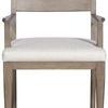 Ridge Dining Arm Chair with light wood frame, structured arms, and light beige upholstered seat cushion