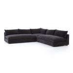 Top-angle side view showing low armrests and plush cushions on charcoal sectional