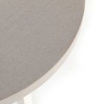 close-up of table edge and base showing crisp junction between gray top and white legs