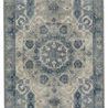 Wool rug with medallion front view in stronger blue tones and lighter gray background
