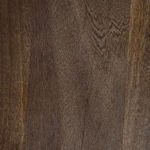 Close-up of rich grain texture and deep brown finish of solid mango wood tabletop