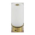 Close-up of cylindrical diffuser top showing a small round brass on/off switch and a USB charging port