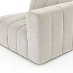 Partial seat and backrest close-up demonstrating smooth channel transitions and soft fabric texture