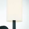 Close-up of the white cylindrical fabric shade and the arm's double ring detailing