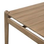 Angle emphasizing rounded leg top and gap between wooden slats