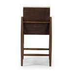 Back view showing woven rattan panel fully covering back of stool