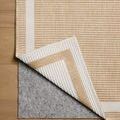 Easton Wheat Ivory rug corner lifted to reveal backing and reversible woven design