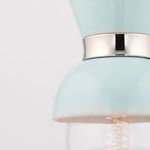 Detailed close-up of the seam between aqua blue shade and polished metal collar