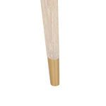 Close-up of tapered leg with brass tip and visible wood grain in cerused oak finish.