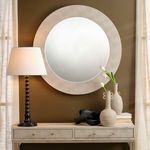Revolution Table Lamp shown in a room setting on console table beside vases and a large round mirror
