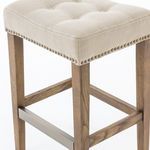 Lower angled view focusing on distressed wood grain of legs and metal kickplate footrest