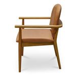 Side profile of Norrie dining chair highlighting sleek armrest and cushion depth