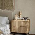 Lubo Breccia bowl styled on nightstand in bedroom with beige walls and wood framed wall art