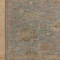 Rug displayed on light wood flooring highlighting corner, edge binding, and subtle pattern variation