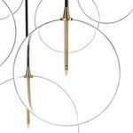 Close-up of clear blown glass globe with brass tip and slender black cord of Cluster 7 MIX Chandelier