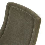 Angled close-up of upper backrest upholstery with velvet piping detail on Blaire Dining Chair