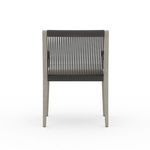 Close-up back view focusing on vertical black rope details with cushion partially visible