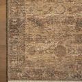 Rug corner detail on wooden floor showing traditional border pattern and neutral color palette