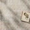 Close-up top view of Townes Beige Clay Rug showing subtle pattern and natural light shadows