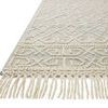 Close-up of Noelle Ivory / Blue Rug showing detailed woven fringe and edge