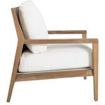 Side view of chair angled to show thickness of seat cushion and teak armrest