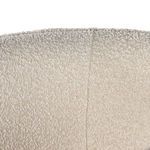 Detailed stitching and fabric intersection on inner backrest curve of Adriel natural swivel chair